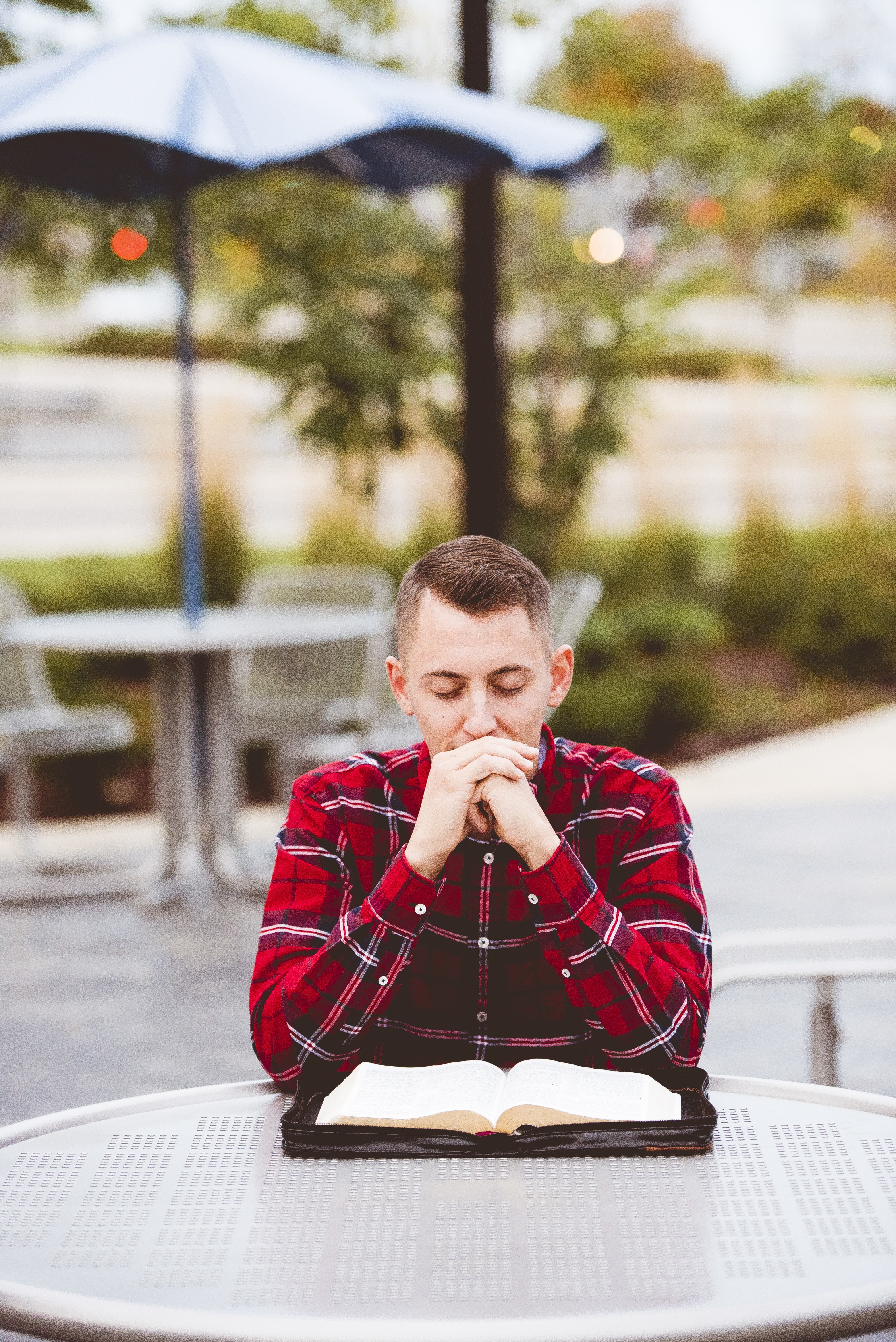 Person sitting quietly with an open book